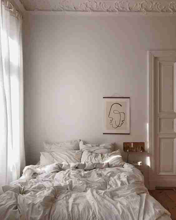 camas deshechas blanco