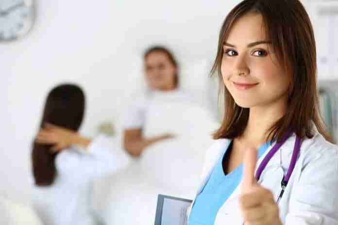 Smiling Female Medicine Doctor Holding Document Pad And Showing