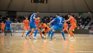 Indoor futsal match scene, players in colorful uniforms competing on a sports court with hard floor, action moment near th...