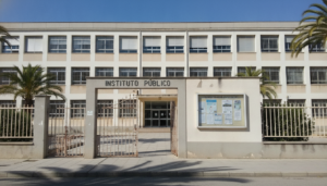 Secondary school building exterior with institutional architecture, entrance gate, educational facility, Spain public scho...