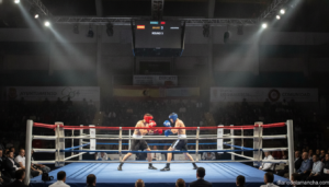 Olympic boxing match inside a well-lit municipal sports auditorium, two athletes in gloves and headgear exchanging punches...