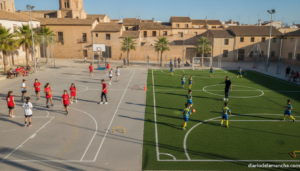 Young children and teenagers playing basketball and football on outdoor sports courts in a Spanish town, sports training c...