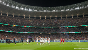Football World Cup match being played in a large modern stadium filled with fans, two teams competing on the pitch, USA na...