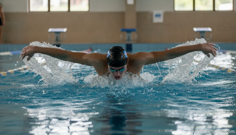 A young competitive swimmer in a swimming pool, mid-race during butterfly stroke, captured from poolside angle, realistic ...