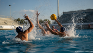 Realistic photojournalism style image of a men's water polo match in an outdoor Olympic swimming pool, players in the wate...