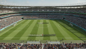 Green football pitch viewed from above with players positioned before a match, stadium full of fans, bright daylight, Worl...